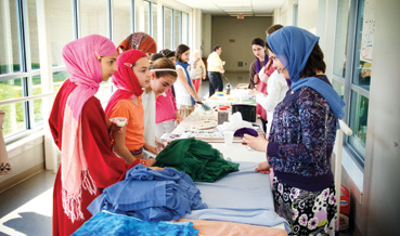Solomon+Schechter+seventh+graders+set+up+a+marketplace+where+student+can+purchase+tea%2C+spices%2C+goat+milk+or+scarves+during+a+school-wide+program+that+turned+the+facility+into+a+mock+village+in+Pakistan+as+the+culmination+of+a+semester-long+curriculum+based+around+the+book+%E2%80%9CThree+Cups+of+Tea%E2%80%9D+by+Greg+Mortenson.