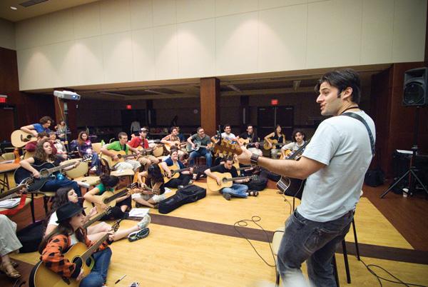 St. Louis Jewish rocker Sheldon Low teaches a class during the Jewish Song Leader Bootcamp held at the Jewish Community Center last week. The three-day program drew songwriters  and  performers from around the country 