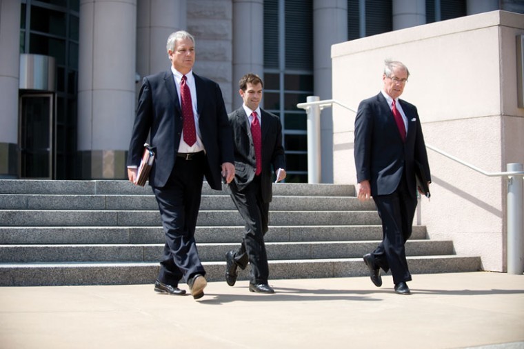 Former State Sen. Jeff Smith (center) leaves the 
federal courthouse downtown in August, 2009 after pleading guilty to conspiracy to obstruct of justice.  
File photo: Matt Mitgang