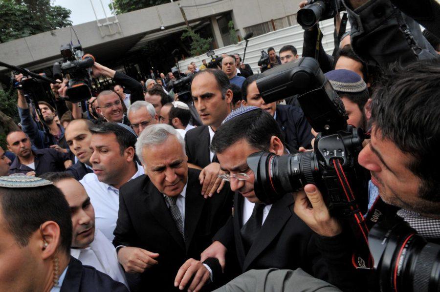 Former Israeli President Moshe Katsav, with gray hair at center, outside a Tel Aviv court on Dec. 30, 2010 after being convicted of raping a government employee, assaulting a female employee of the Presidents Residence and sexually harassing an 18-year-old female National Service volunteer. (Yossi Zeliger / Flash90 / JTA)