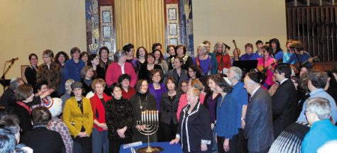 At a program in suburban Boston titled “Raising Up the Light,” 50 female rabbis in the audience were called up to the bima in tribute, Dec. 6, 2010.