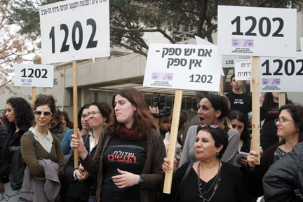 Women demonstrate Dec. 30 outside the Tel Aviv courtroom where former Israeli President Moshe Katsav was convicted of rape and other sex crimes. Photo: Roni Schutzer / Flash90 / JTA