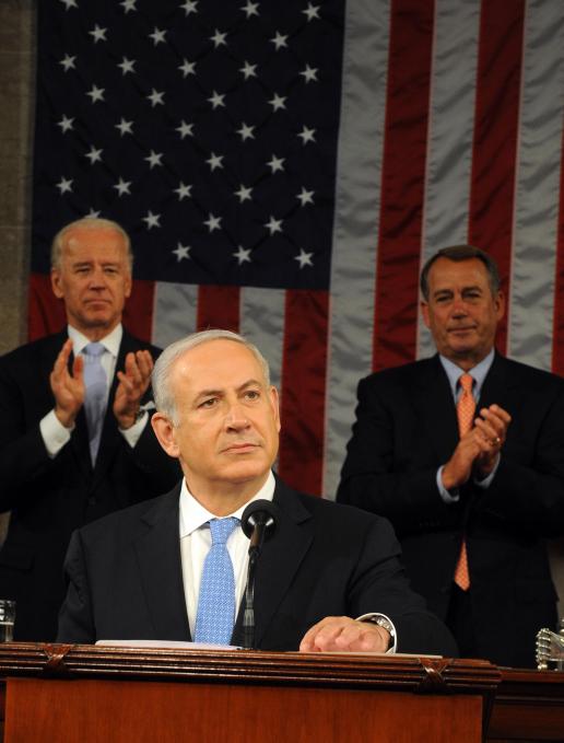 Israeli Prime Minister Benjamin Netanyahu brings Vice President Joe Biden, left, and House Speaker John Boehner to their feet during his speech to the U.S. Congress, May 24, 2011. 