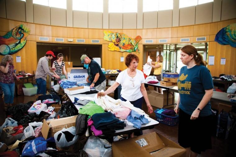 Volunteers work at Central Reform Congregation on Tuesday afternoon to sort items donated to send to Joplin, Mo. Photo: Kristi Foster