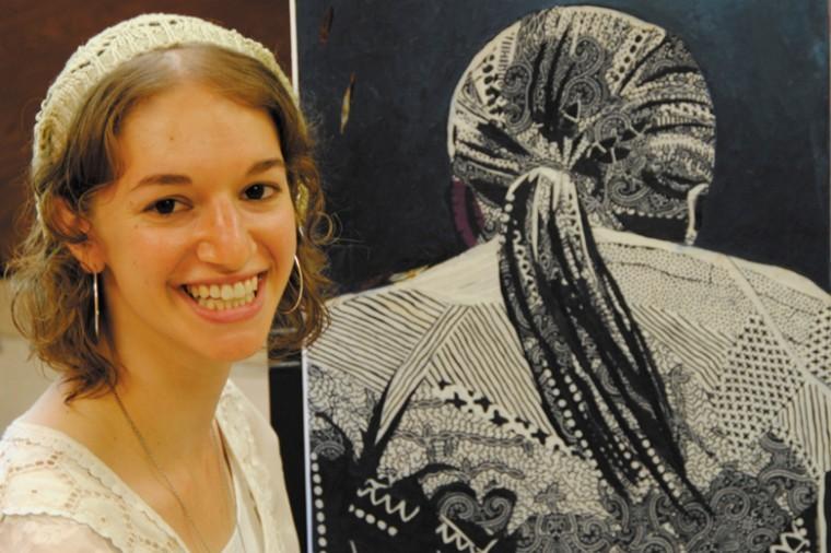 
Tanya Fredman with
one of the paintings featured in her upcoming exhibition on Sunday
at the Insbrook Resort Conference Center
