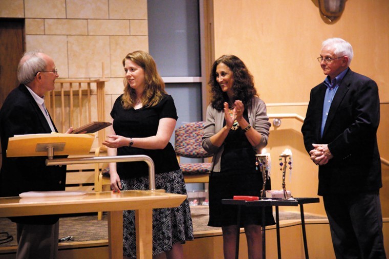 Rev. Dr. John Bennett (left) and Rev. Allen Ladage (right) of
Missouri Interfaith Impact give Central Reform Congregations
Jennifer Bersdale and Rabbi Susan Talve the first annual Amos 5:24
Justice Avocate Award during CRCs Shabbat services Friday night.
Photo: Kristi Foster
