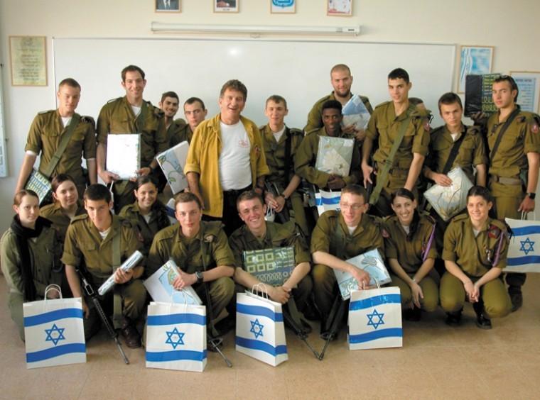 IDF Lt. Col. Tzvia Levy, surrounded by soldiers
