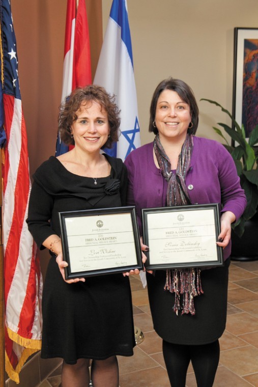 Lori Wishne, left, and Sonia Dobinsky holding their Goldstein
Service Awards given by the Jewish Federation.
