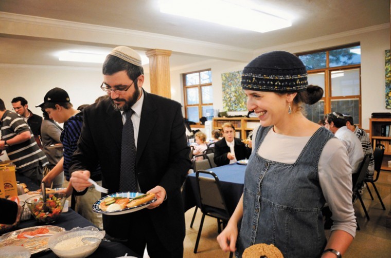 Torah MiTzion Kollel's international director Boaz Genut (left)
and Gilat Gastfraind, shlichim to St. Louis, are shown during a
breakfast Sunday at Bais Abraham Congregation, ending a four-day
conference held in St. Louis. For a gallery of images from the
events, visit www.stljewishlight.com. Photo: Yana Hotter
