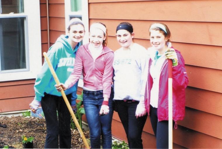 Samantha Mishkin, second from left, works with friends at
Rainbow Village
