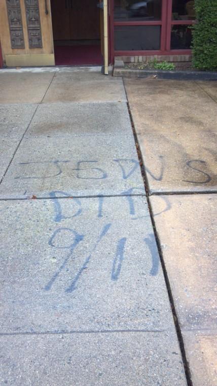 Vandalism reading Jews Did 9/11 scrawled at Temple Beth Israel
in Hackensack, N.J., Dec. 10, 2011.
