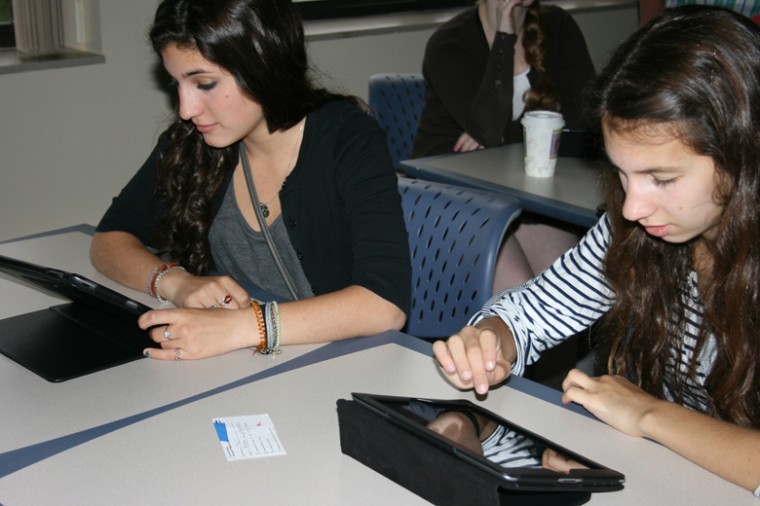 Mollie Darmon, left, and Allie Lichterman, seniors at the
Frankel Jewish Academy in suburban Detroit, using their iPads in
class.
