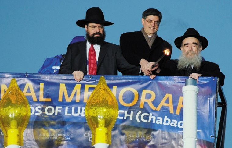 Jack Lew, center, helps light the national menorah organized
by American Friends of Lubavitch, with the groups director, Rabbi
Levi Shemtov, left, and his father, Rabbi Abraham Shemtov, the
director of Agudas Chasidei Chabad, Dec. 20, 2011. Baruch Ezagui,
courtesy of American Friends of Lubavitch.
