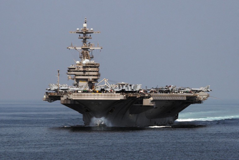 The+aircraft+carrier+USS+George+H.W.+Bush%2C+part+of+the+5th%0AFleet%2C+transits+through+the+Strait+of+Hormuz%2C+Oct.+9+2011.+Iran+has%0Athreatened+to+shut+off+the+strait%2C+through+which+much+of+the%0Aworlds+oil+travels%2C+if+it+faces+new+sanctions.+U.S.+Navy+photo+by%0AMass+Comm.+Specialist+3rd+Class+Betsy+Knapper%0A