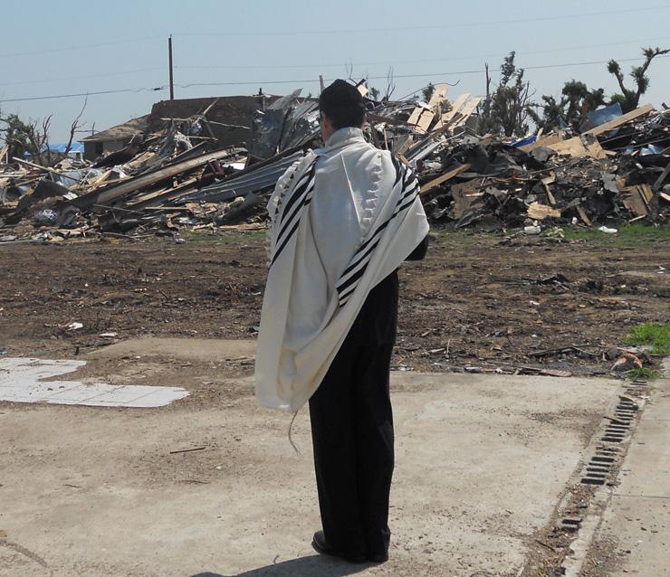 Cantor Ron Eichaker from United Hebrew Congregation in St. Louis
traveled with his wife, Heidi, to lead Shabbat services in Joplin,
Mo. at the city’s sole synagogue, also called United Hebrew.
Eichaker visited the site with one congregant of the Joplin
synagogue who lost his home during the devastating tornado that
struck the city. While the congregant, Steve Fisher, was speaking
with a FEMA representative, Cantor Eichaker offered three prayers:
 the afternoon Shabbat prayers facing East; then, facing St. John’s
Hospital, he offered the Eil Malei Rachamim for the dead and a Mi
Shebeirach for the living, the volunteers and professionals
involved in the clean up.
