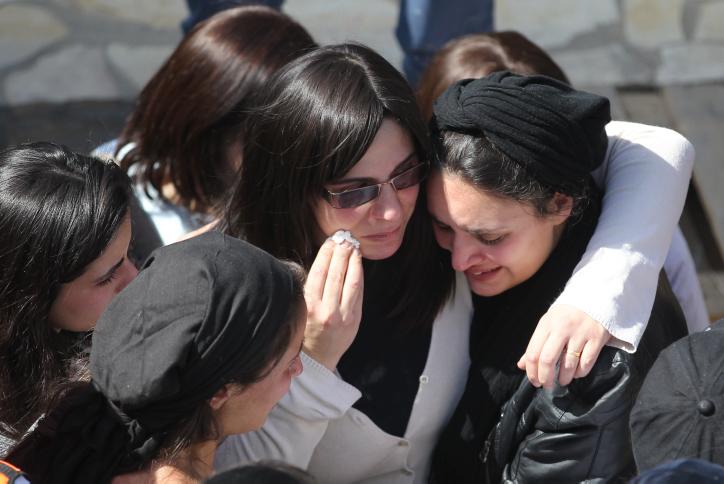 The wife of Rabbi Jonathan Sandler, 30, and their 6-year-old sons Arieh and 3-year-old son Gabriel, mourns at the funeral of her family in jerusalem. Rabbi Sandler and his sons were killed together with 8-year-old Miriam Monsonego a few days ago when a gunman shot and killed the four at a Jewish school in Toulouse, France. March 21, 2012. Photo by Nati Shohat/FLASH90/JTA
