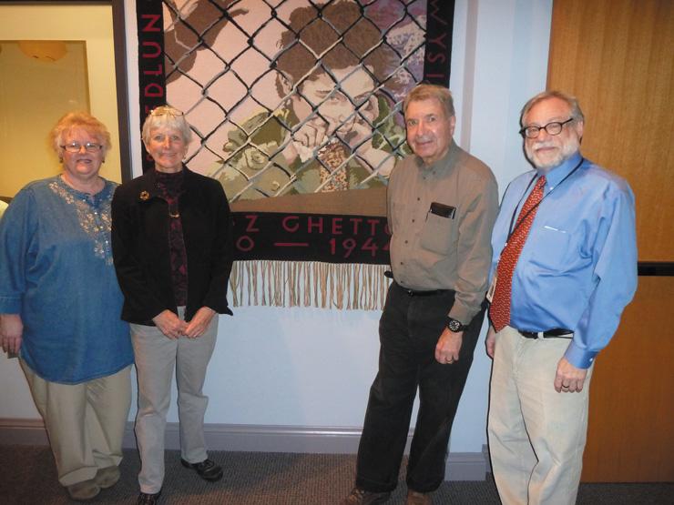 From left: Jane Olson Glidden, Weavers’ Guild of St. Louis; Linda Koenig, Holocaust Museum docent who is leading the tour sponsored by the Missouri History Museum; Sheldon Helfman, husband of the late artist, and Dan Reich, Holocaust Museum Curator and Director of Education.
