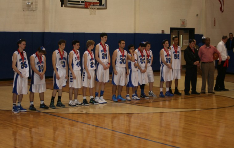 Beren Academy players and coaches receive their second-place medals after losing to Abilene Christian in the Texas 2A state final, March 3, 2012.
