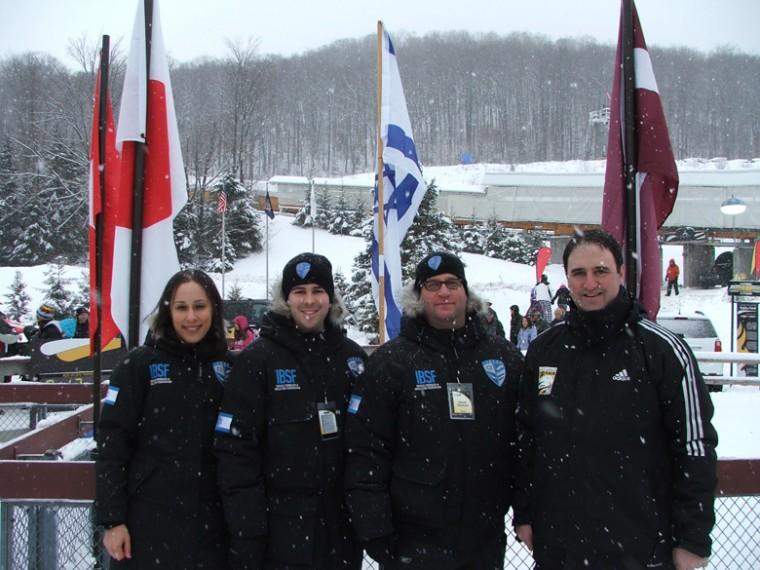 The team behind Israeli skeleton competitor Bradley Chalupski, second from left—left to right, marketing director Tamar Simon, CFO Philip Nathan, fundraiser David Greaves and coach Andy Teig—at the track in Lake Placid, N.Y., on opening day of the mens skeleton world championships, Feb. 24, 2012.

