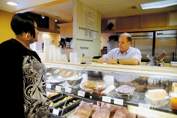 Harlan Levin, the new owner of Pumpernickel’s Delicatessen in Creve Coeur, takes an order from a customer on Monday.
