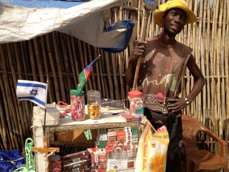 James Lago, a street merchant in Juba, South Sudan, with the Israeli flag.
