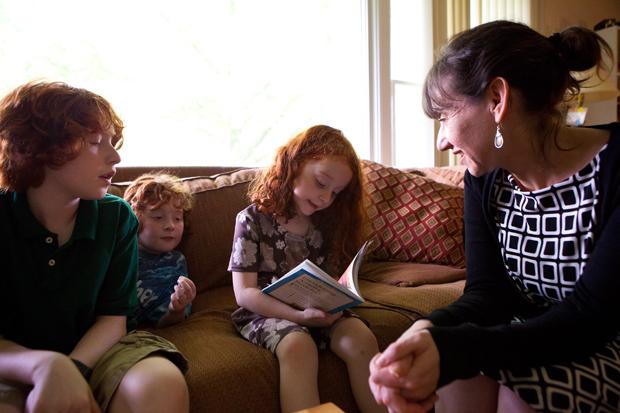 Rabbi Andrea Goldstein spends time with her children, Macey, 12, Eli, 10, and Lila, 6 at home. Goldstein has served Congregation Shaare Emeth for the past 13 years.
