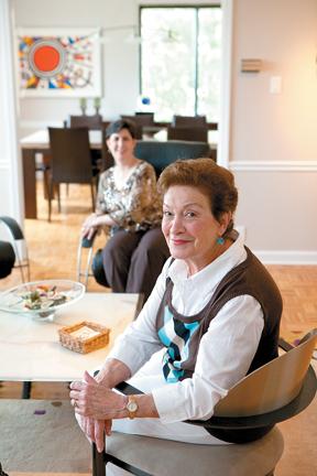 Sarijane Freiman with her daughter, Rebecca Helfer, in the background. The photo was taken in Mrs. Freiman's home. 