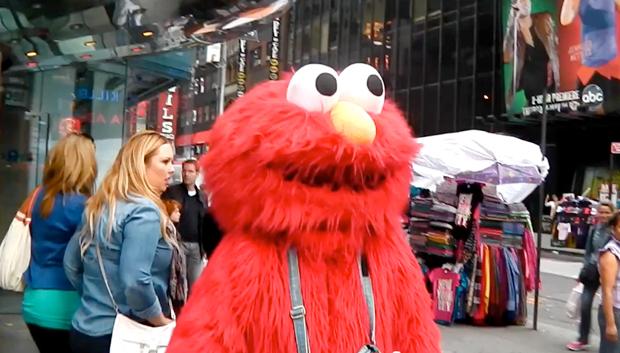 A man dressed as Elmo from Sesame Street is shown yelling anti-Semitic slurs in New Yorks Times Square, June 2012.

