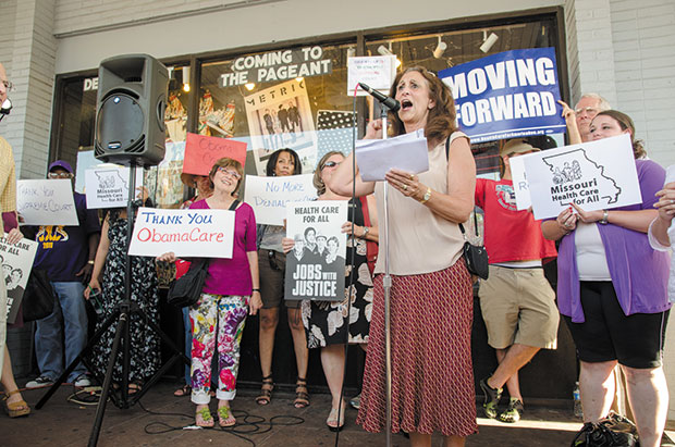Rabbi Susan Talve addresses the crowd at a health care rally on Thursday evening in front of Vintage Vinyl in the U. City Loop. Several Jewish organizations and congregations were represented at the rally.
