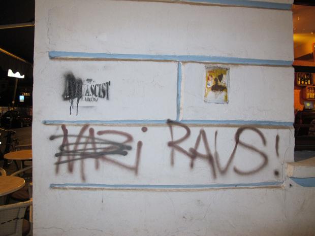 Graffiti+on+the+wall+of+the+Moment+cafe+in+Krakows+Kazimierz+Jewish+quarter+read+Nazi+Raus%21+and+also+cross+out+the+anti+in+anti-Fascist.%0A