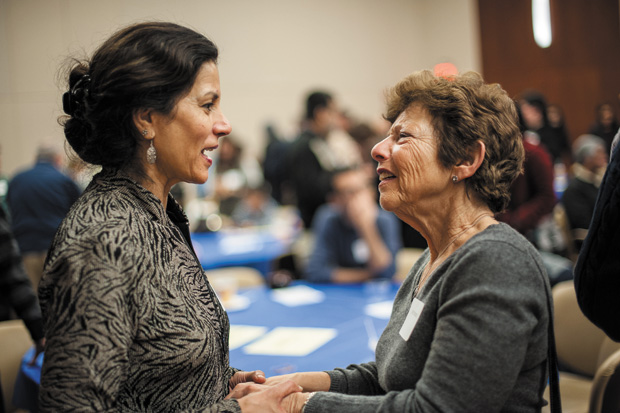 Dr. Ghazala Hayat (left) talks with Joy Sterneck at the welcome breakfast of the Jewish-Muslim Day of Service on Dec. 25.  The Jewish Community Relations Council organized the second annual event. After the breakfast event at the Jewish Community Center in Creve Coeur, participants fanned out to more than 20 area sites to volunteer. Photo: Yana Hotter
