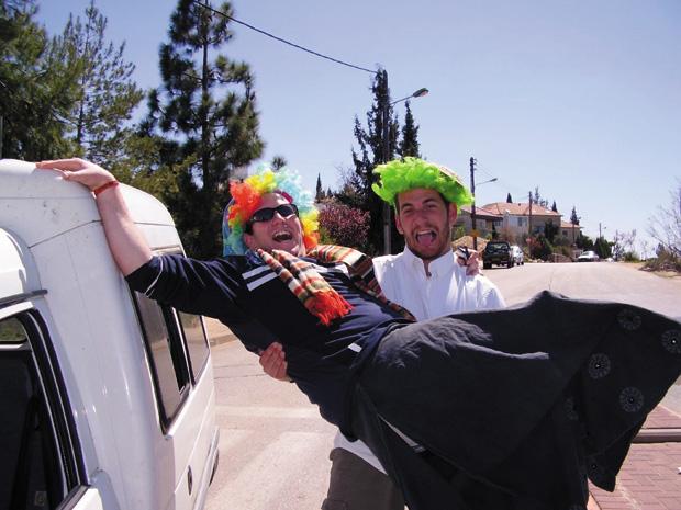 These Israelis follow the edict for Purim revelry. Photo: Yoel Ben-Avraham/Creative Commons/JTA
