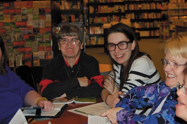 At a weekly book club meeting, Alyson and club participants take turns reading a biography of Abraham Lincoln.
