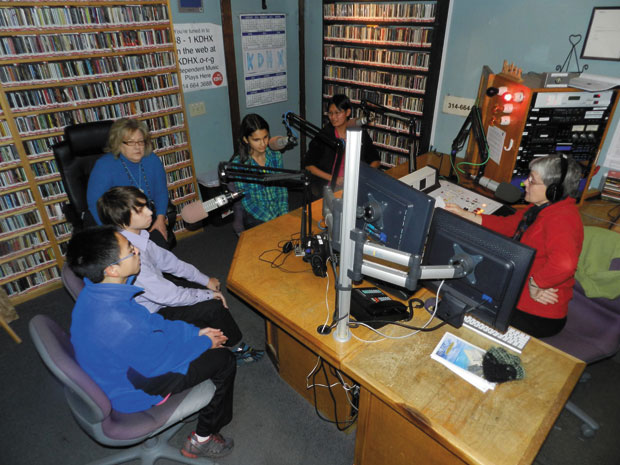 Hard at work on the Clayton Plastic Bag Campaign, Ben Schneider (second from left) and classmates Victor Xie, Claire Millet, Elise Yang are interviewed on KDHX 88.1 FM. 
