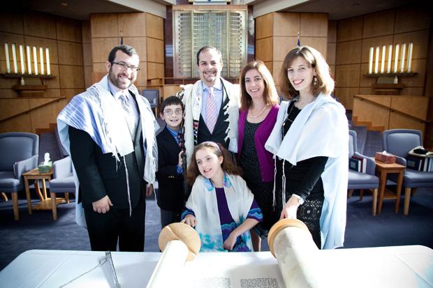 Lilly+Opinsky+celebrated+her+bat+mitzvah+recently+at+Congregation+B%E2%80%99nai+Amoona.+Lilly%2C+who+has+Rett+Syndrome%2C+has+been+%E2%80%9Cfully+included+in+every+bit+and+piece+of+B%E2%80%99nai+Amoona+life+that+we%E2%80%99ve+come+across%2C%E2%80%9D+according+to+her+father%2C+Larry+Opinsky%2C+who+also+serves+as+the%C2%A0+president+of+B%E2%80%99nai+Amoona%E2%80%99s+inclusion+committee.%C2%A0+Pictured+with+Lilly+%28at+center%29+are+%28from+left%29+Rabbi+Ari+Kaiman%2C+Sam%2C+Larry+and+Joyce+Opinsky+and+Hazzan+Sharon+Nathanson.+Photo%3A+Kristi+Foster%C2%A0