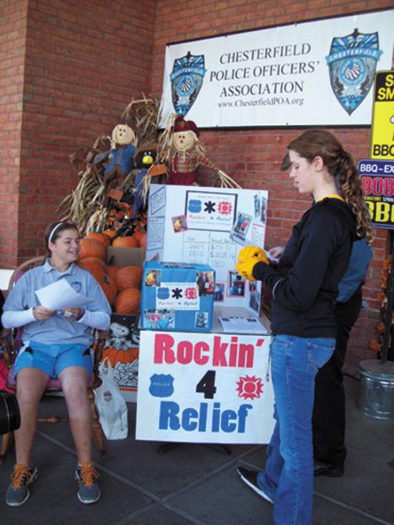 At the 2011 Rockin’ For Relief,  Jennifer helps fundraise from Dierbergs shoppers. (Photo by Mia Kweskin) 