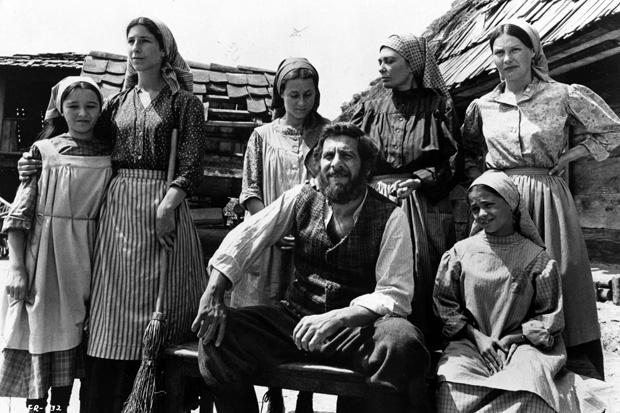 Oscar nominee Chaim Topol, as Tevye (sitting in center), in 1971 Best Picture nominee “Fiddler on the Roof.”  The film received eight Academy Award nominations.