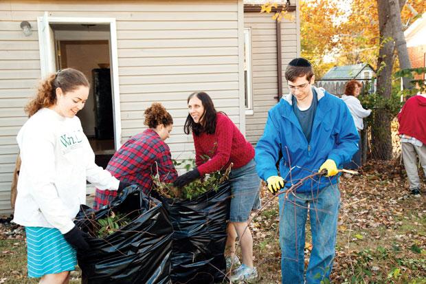 Volunteers with Bais Abraham’s new Learning/Chesed project work with the organization Beyond Housing to help on a home rehab site in Normandy. The congregation has started a year-long program combining learning and community service projects to help Normandy residents. Photos: Kristi Foster 