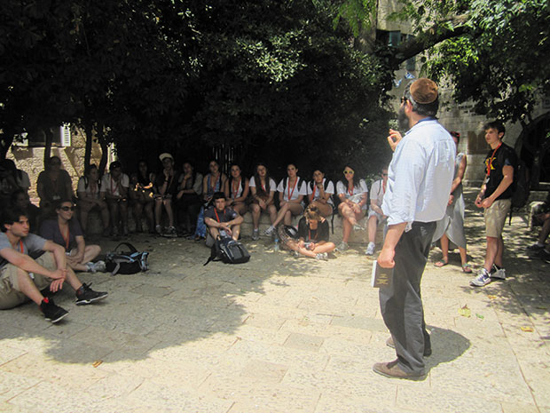 Standing in the Old City of Jerusalem, Rabbi Hersh Novack lectures to a group of Washington University and St. Louis area college students during a recent Taglit Birthright Israel trip. Birthright Israel is a partnership between the Jewish Federations, the Jewish Agency, and leading individual philanthropists.
