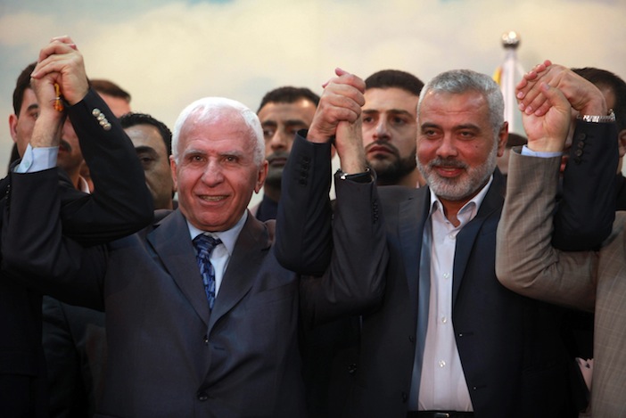 Head+of+the+Hamas+government+Ismail+Haniyeh+and+senior+Fatah+official+Azzam+Al-Ahmed+attend+a+news+conference+as+they+announce+a+reconciliation+agreement+in+Gaza+City+on+April+23%2C+2014.+%28Abed+Rahim+Khatib%2FFlash90%29