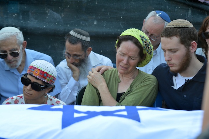Rachel Fraenkel, the mother of Naftali Fraenkel, crying over the body of her son at the joint funeral for three murdered Jewish teens in the Modiin cemetery, July 1, 2014. (Flash 90)
