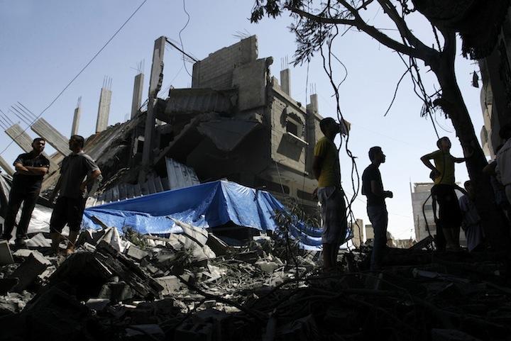 %0APalestinians+walking+among+the+rubble+of+a+destroyed+house+following+an+Israeli+missile+strike%2C+in+Rafah%2C+in+the+southern+Gaza+Strip%2C+July+14%2C+2014.+Photo%3A+Abed+Rahim+Khatib%2FFlash+90%0A