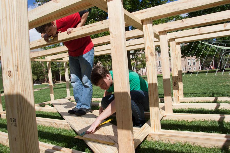 University+of+Louisana+at+Lafayette+graduate+students+Garrett+Armentor+%28left%29+and+John+Welcher+work+on+constructing+the+sukkah+design+of+their+professor%2C+Ashlie+Latiolais%2C+on+Oct.+6+at+Washington+University.+Latiolais+design+was+one+of+10+finalists+in+Sukkah+City+STL%2C+held+by+St.+Louis+Hillel+and+Wash+U.