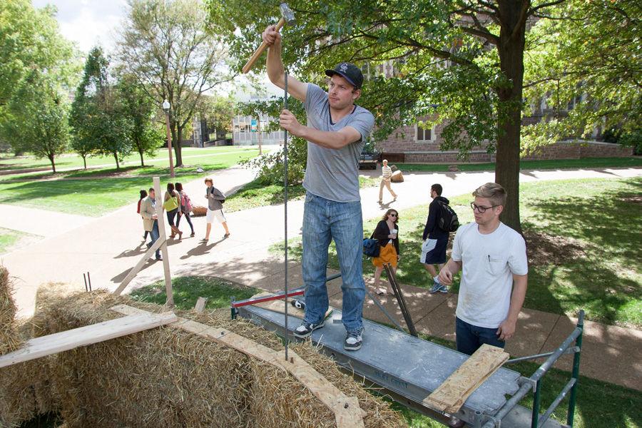 Kansas+State+architecture+students+Eric+Dernbach+%28in+baseball+cap%29+and+Andy+McAllister+work+on+constructing+fellow+student+%28not+pictured%29+Devin+Browns+sukkah+design+on+Oct.+6%2C+2014+at+Washington+University.+Browns+design%2C+made+of+hay+bales%2C+was+one+of+10+finalists+in+Sukkah+City+STL%2C+held+by+St.+Louis+Hillel+and+Wash+U.+The+teams+constructed+their+sukkot+on+the+quadrangle+just+west+of+the+universitys+Olin+Library.
