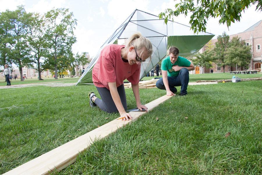 University of Louisiana at Lafayette graduate student John Welcher and professor Ashlie Latiolais work on constructing Latiolais sukkah design on Oct. 6, 2014 at Washington University. Latiolais design was one of 10 finalists in Sukkah City STL, held by St. Louis Hillel and Wash U. The teams constructed their sukkot on the quadrangle just west of the universitys Olin Library.