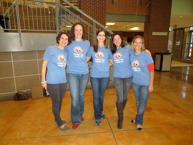 Five members of the  “Jew Crew,” from left to right: Dana Emmenegger, Stefanie Sanger, Sarah Mermelstein, Anna Reby Bertman and Beth Lehrer at a previous Joey Eidelman Memorial Blood Drive in Clayton. The women are wearing T-shirts that say, “Monkey See, Monkey Do” in honor of Joey, who was endearingly called little monkey. 