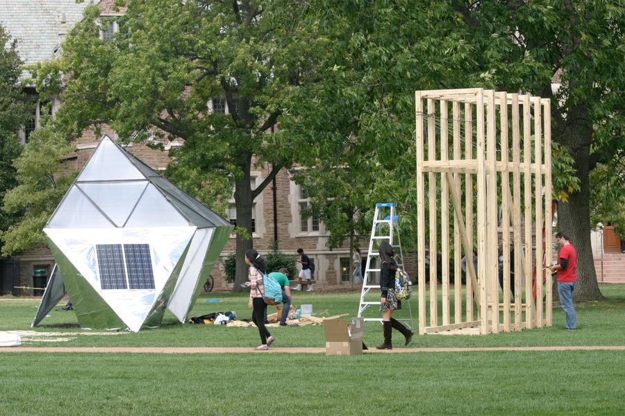 Washington+University+students+walk+by+two+of+10+winning+sukkah+designs+being+constructed+Monday+in+the+quadrangle+just+west+of+the+universitys+Olin+Library+as+part+of+the+Sukkah+City+STL+competition.+Held+by+Washington+University+and+St.+Louis+Hillel%2C+the+10+winning+sukkot+will+be+on+display+through+Oct.+12.+A+variety+of+Jewish+community+events+have+been+planned+as+part+of+Sukkah+City+STL.+For+full+details%2C+visit+http%3A%2F%2Fbit.ly%2Fsukkah-city.+The+holiday+of+Sukkot+begins+at+sundown+Wednesday.+Photo%3A+Mike+Sherwin