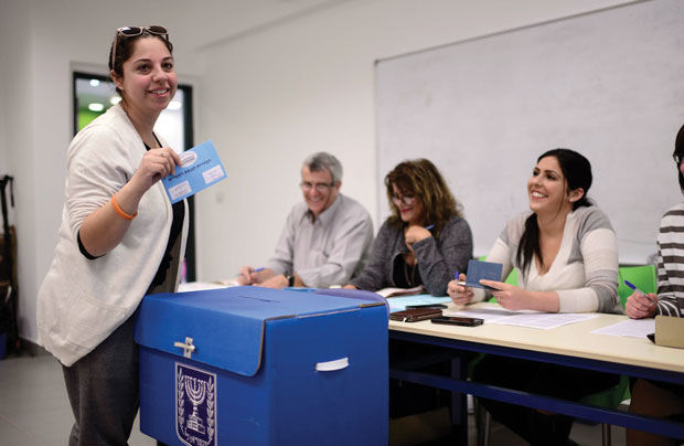 Israeli+citizens+cast+their+votes+at+a+ballots+station+in+Tel+Aviv+on+elections+day+for+the+20th+Knesset%2C+March+17%2C+2015.+Photo+by+Tomer+Neuberg%2FFlash90