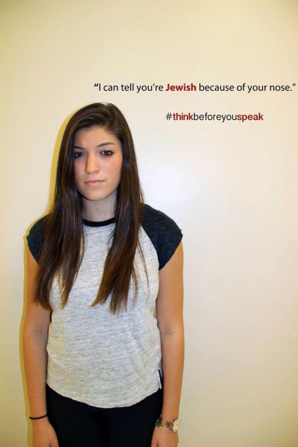 Becca Polinsky, senior at Clayton High School, poses in front of a offensive statement. Photo courtesy of Becca Polinsky