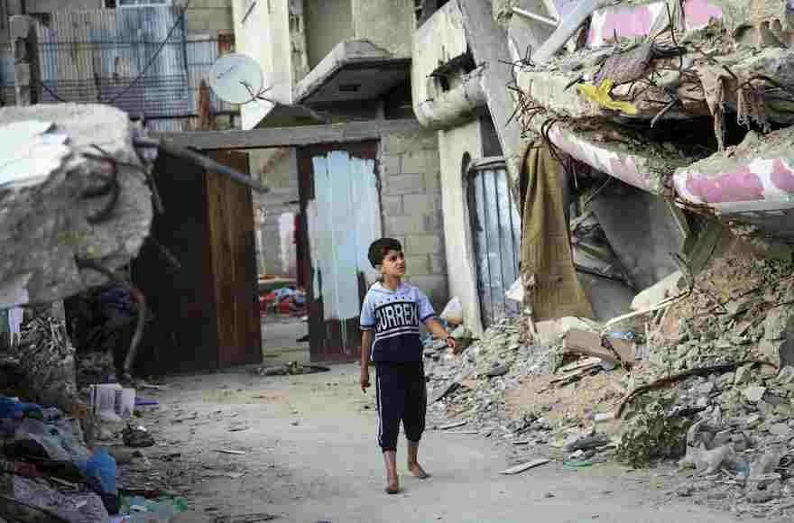 A+Palestinian+child+amid+the+rubble+of+buildings+in+Gaza+City+that+were+destroyed+during+the+summer+of+2014+war+between+Israel+and+Hamas%2C+June+22%2C+2015.+%28Aaed+Tayeh%2FFlash90%29